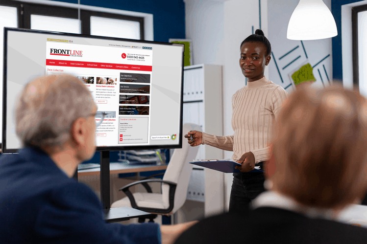 Business meeting presentation showing Frontline Collections – London Office (Debt Collection) website on a screen.